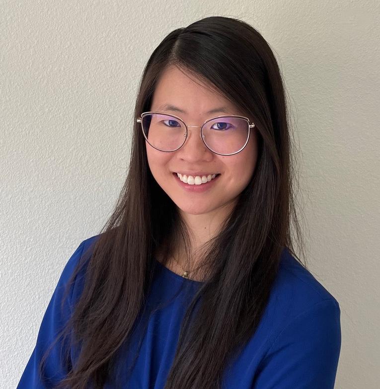 a photo of me wearing a blue blouse. I have long hair and wear glasses.